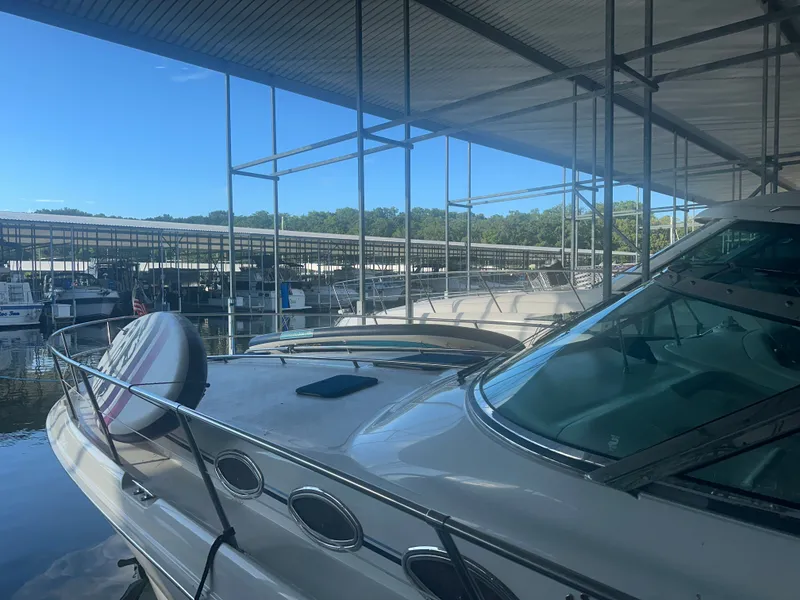 Slide: The Image of A 1997 Sea Ray Sundancer 370 docked in a covered marina. - 6