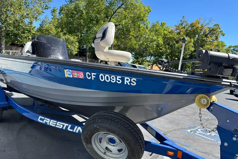 Slide: The Image of 2008 Crestliner 1750 Fish Hawk SC boat on trailer, parked outdoors. - 4