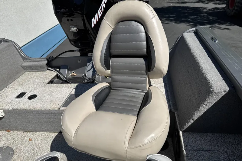 Slide: The Image of Crestliner 1750 Fish Hawk SC 2008 boat seat with gray and beige upholstery. - 10