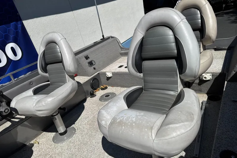 Slide: The Image of 2008 Crestliner 1750 Fish Hawk SC boat seats, featuring gray and black upholstery. - 9