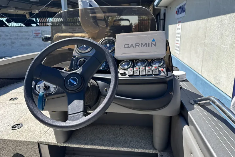 Slide: The Image of 2008 Crestliner 1750 Fish Hawk SC dashboard with Garmin navigation system and steering wheel. - 15