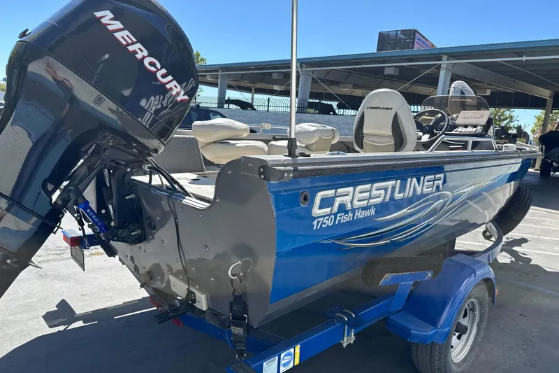 Slide: The Image of 2008 Crestliner 1750 Fish Hawk SC boat with Mercury engine on trailer. - 5