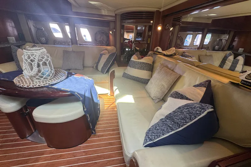 Slide: The Image of Luxurious interior of 2006 Sea Ray 52 Sundancer yacht with plush seating and nautical decor. - 18