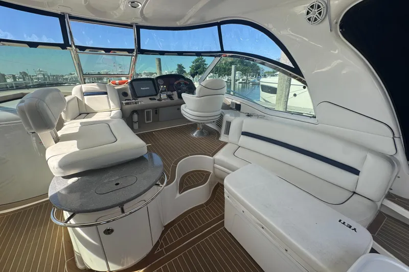 Slide: The Image of Luxurious interior of 2006 Sea Ray 52 Sundancer yacht with plush seating and helm. - 5