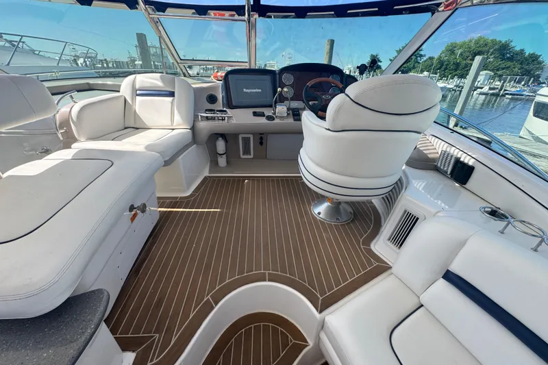 Slide: The Image of Luxurious 2006 Sea Ray 52 Sundancer yacht interior with plush seating and modern navigation equipment. - 6