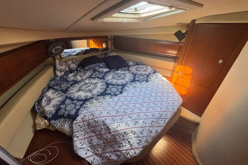 Slide: The Image of Luxurious cabin interior of 2006 Sea Ray 52 Sundancer yacht with cozy bedding. - 12