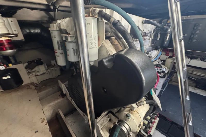 Slide: The Image of Engine room of a 2006 Sea Ray 52 Sundancer yacht, showcasing mechanical components. - 23