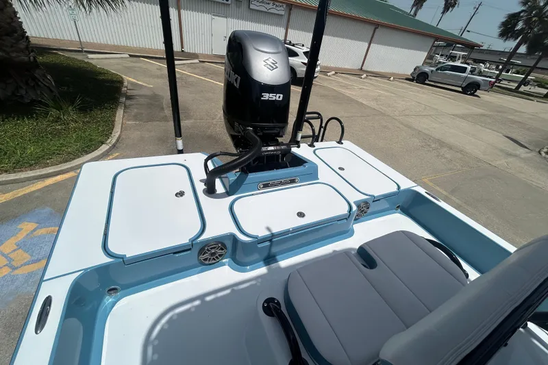 Slide: The Image of 2026 Shallow Sport 25 X3 boat with Suzuki 350 engine in parking lot. - 24