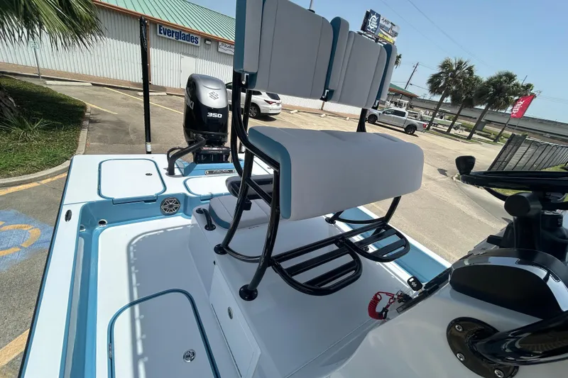 Slide: The Image of 2026 Shallow Sport 25 X3 boat with Suzuki 350 engine, parked near Everglades building. - 23