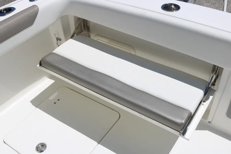 Slide: The Image of Foldable seat on 2022 World Cat 280 DC-X boat, featuring sleek design and comfortable padding. - 19