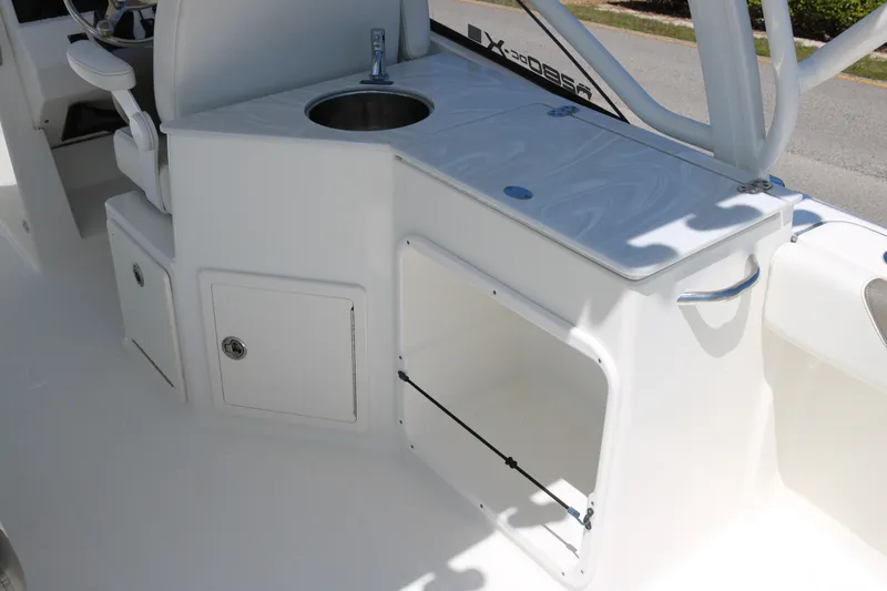 Slide: The Image of 2022 World Cat 280 DC-X boat interior with sink and storage compartments. - 13