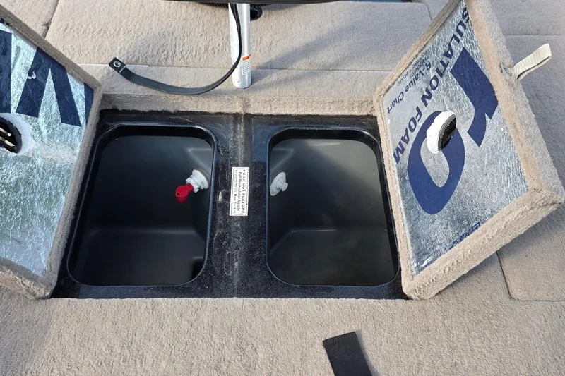 Slide: The Image of Open storage compartments on a 2012 Nitro Z-7 boat deck. - 32