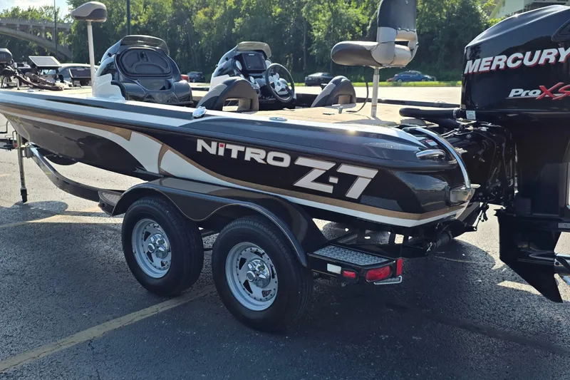Slide: The Image of 2012 Nitro Z-7 boat with Mercury Pro XS engine, parked on pavement. - 7