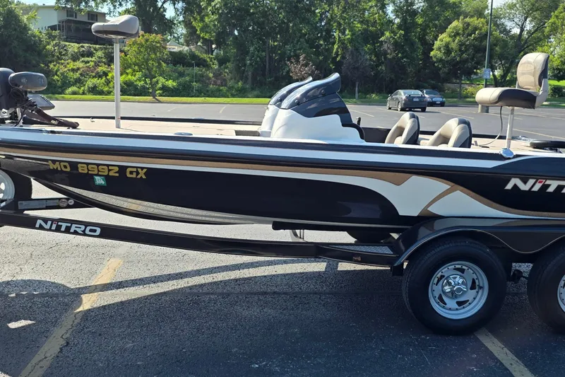 Slide: The Image of 2012 Nitro Z-7 boat on trailer in parking lot, featuring sleek design and comfortable seating. - 3