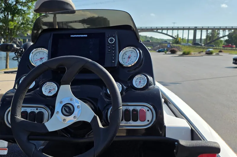 Slide: The Image of Steering console of a 2012 Nitro Z-7 boat with gauges and a Humminbird display. - 11