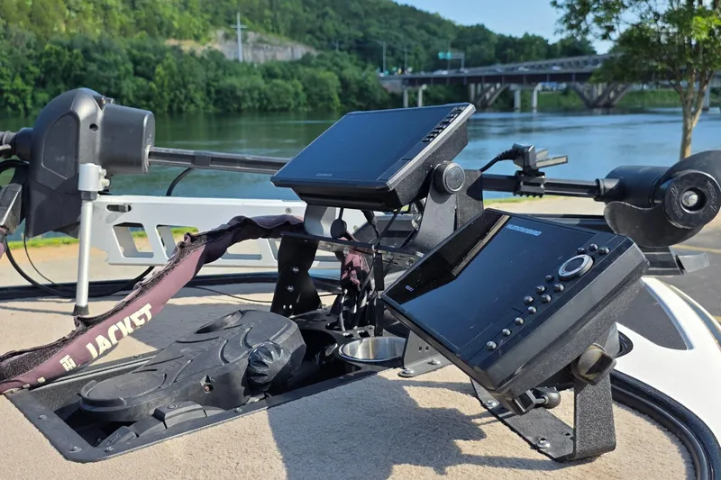 Slide: The Image of Fishing boat dashboard with electronic displays, Nitro Z-7, 2012 model, near a scenic river. - 10
