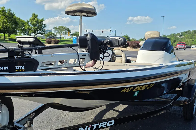 Slide: The Image of 2012 Nitro Z-7 boat with Minn Kota Ultrex motor in a parking lot. - 5