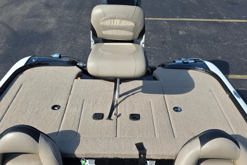 Slide: The Image of 2012 Nitro Z-7 boat interior with beige seating and carpeted deck. - 34