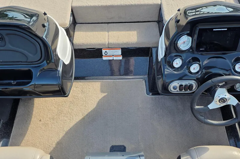 Slide: The Image of Interior of a 2012 Nitro Z-7 boat showing dashboard and steering wheel. - 29