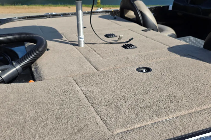 Slide: The Image of Carpeted deck of a 2012 Nitro Z-7 boat with storage compartments. - 23