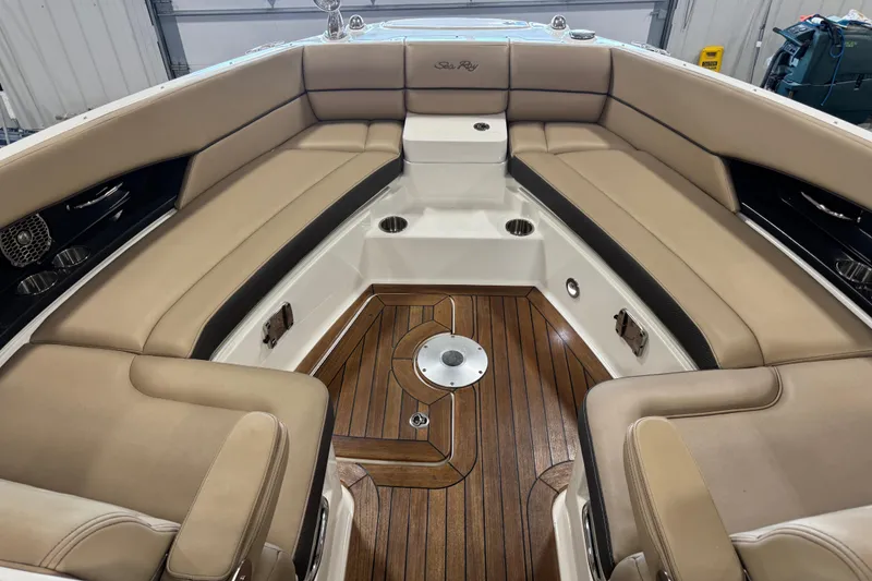 Slide: The Image of Luxurious interior of 2016 Sea Ray SLX 350 boat with tan seating and wood flooring. - 13