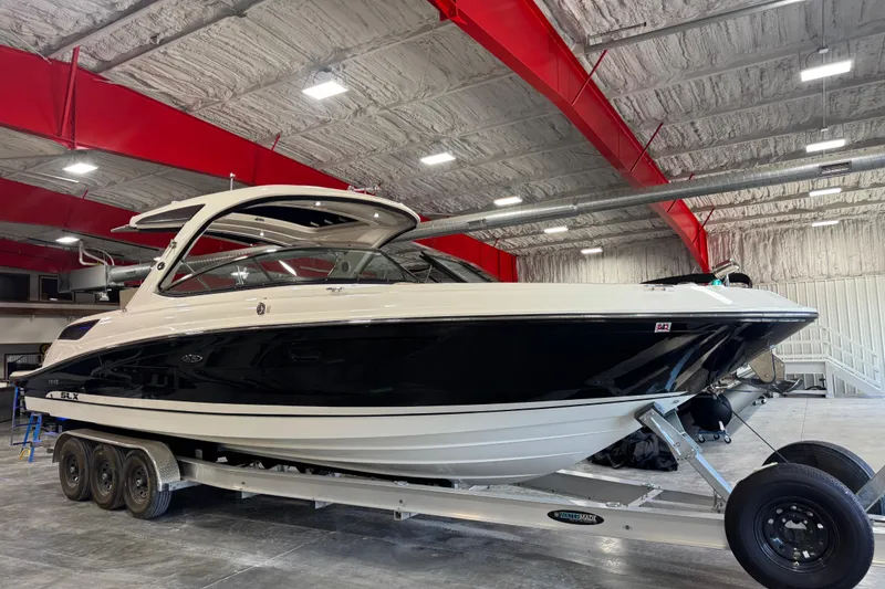 Slide: The Image of 2016 Sea Ray SLX 350 boat on trailer in indoor storage facility. - 2