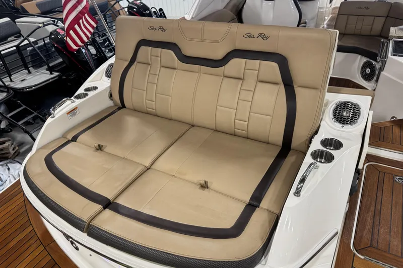 Slide: The Image of Luxurious seating on 2016 Sea Ray SLX 350 boat with cup holders and speakers. - 10