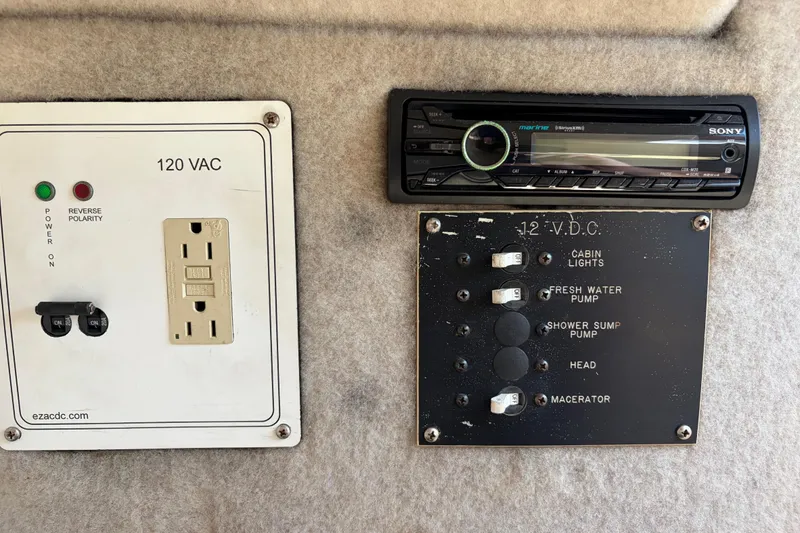 Slide: The Image of Control panel and stereo system on a 1991 Donzi 255 LXC boat. - 12