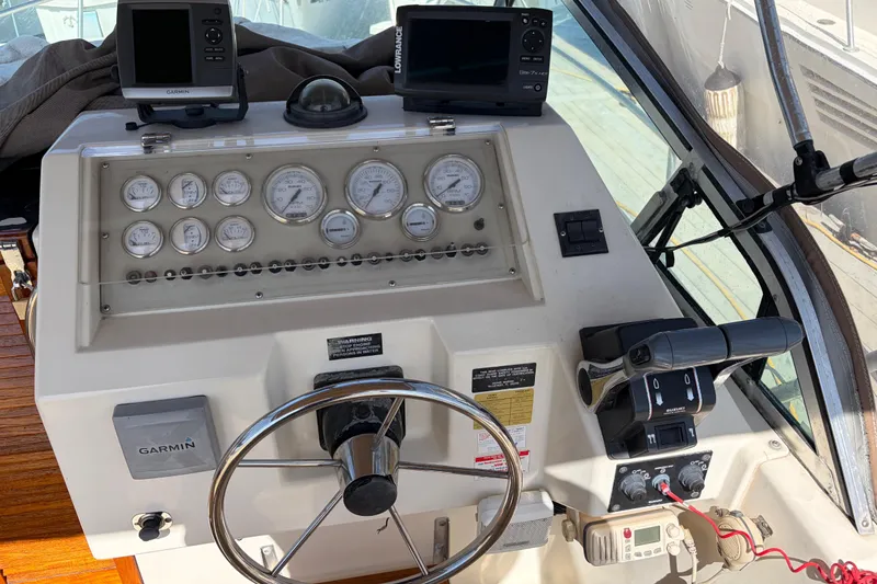 Slide: The Image of 1991 Donzi 255 LXC boat dashboard with Garmin and Lowrance navigation systems. - 8