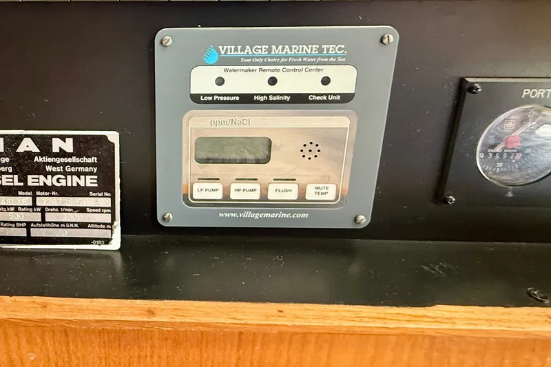 Slide: The Image of Control panel of a 1994 Viking 47 Convertible boat with watermaker and engine details. - 40