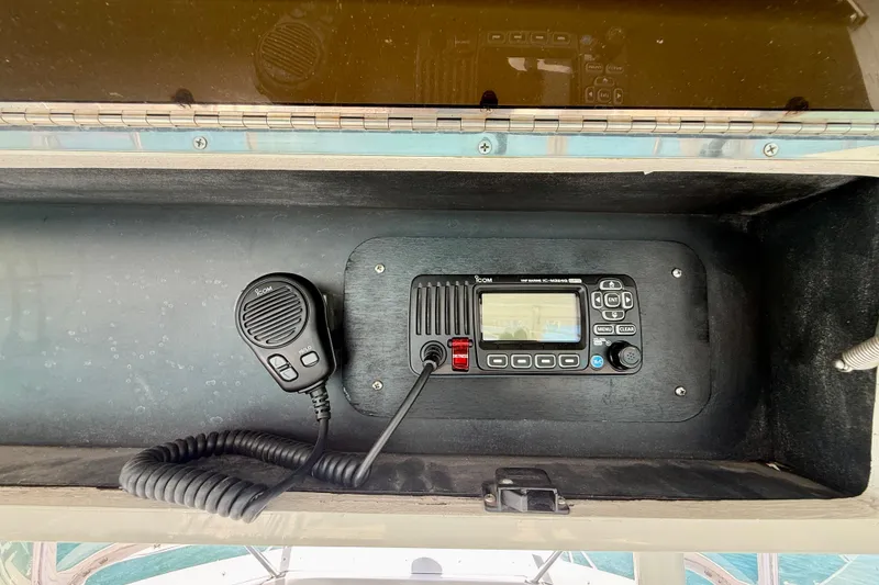 Slide: The Image of VHF marine radio and microphone on 1994 Viking 47 Convertible yacht dashboard. - 63