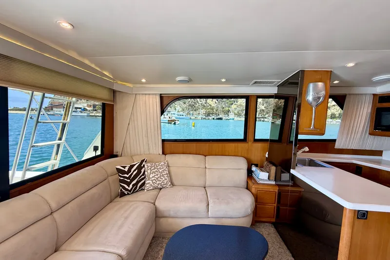 Slide: The Image of Luxurious interior of a 1994 Viking 47 Convertible yacht with scenic water views. - 17