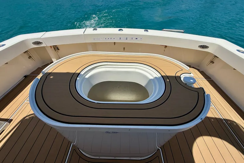 Slide: The Image of Fishing cockpit on a 1994 Viking 47 Convertible yacht with teak flooring. - 45