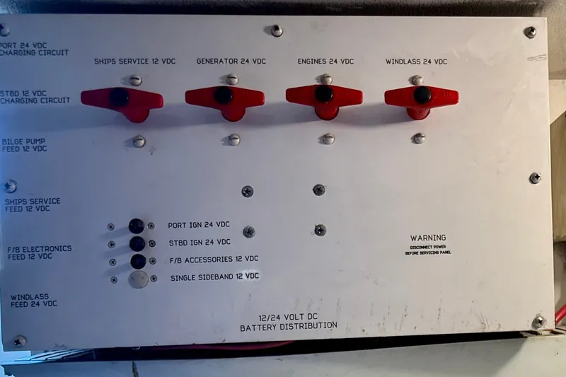 Slide: The Image of Electrical panel on a 1994 Viking 47 Convertible boat, showing battery distribution switches. - 79