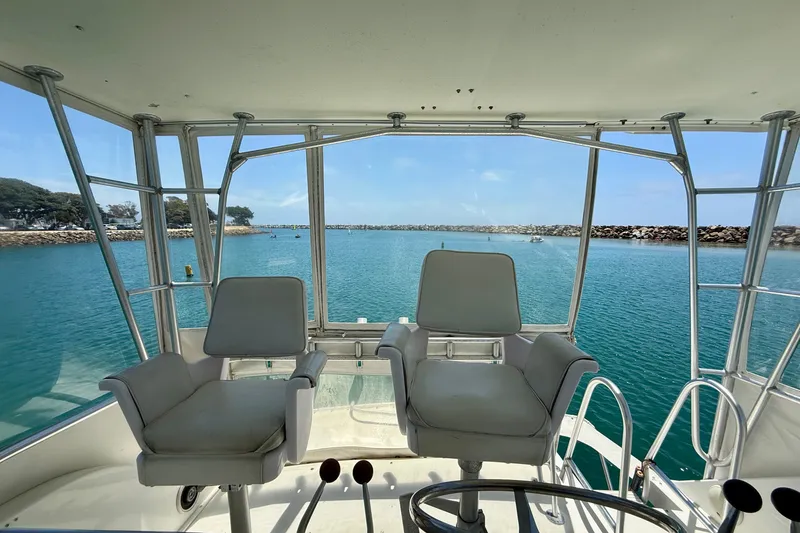 Slide: The Image of Interior view of 1994 Viking 47 Convertible yacht overlooking serene blue waters. - 57