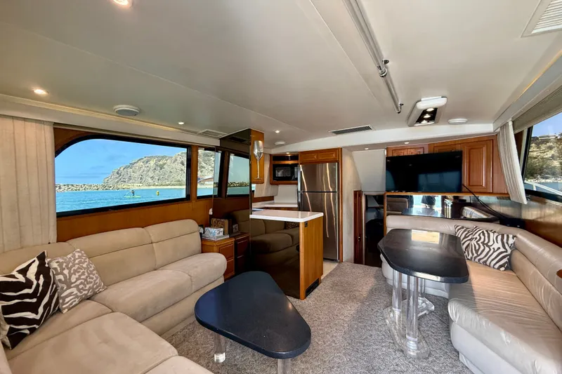 Slide: The Image of Luxurious interior of a 1994 Viking 47 Convertible yacht with scenic ocean view. - 9