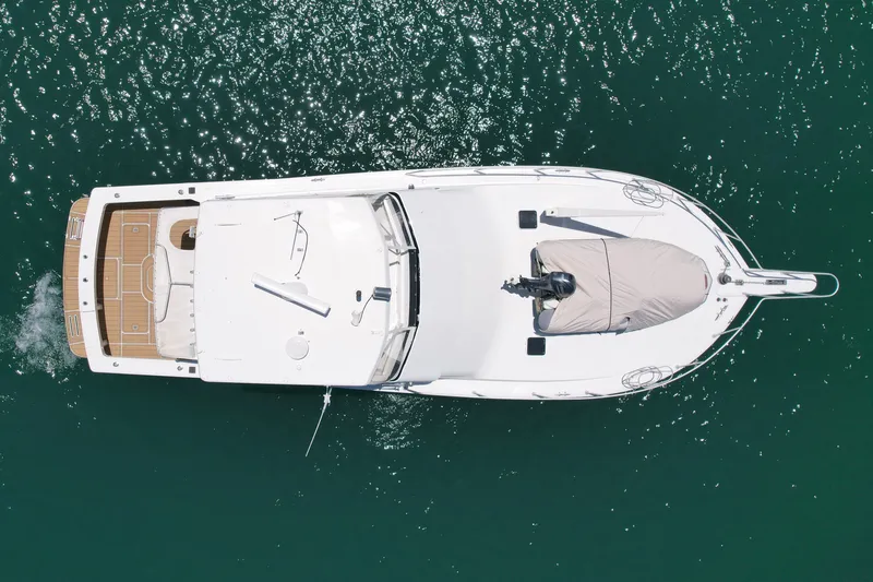 Slide: The Image of Aerial view of 1994 Viking 47 Convertible yacht on clear water. - 8
