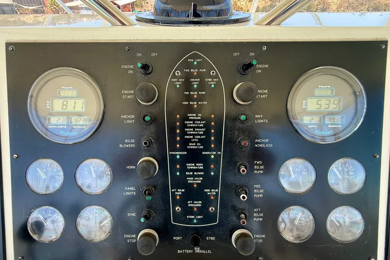 Slide: The Image of Control panel of a 1994 Viking 47 Convertible boat with gauges and switches. - 64