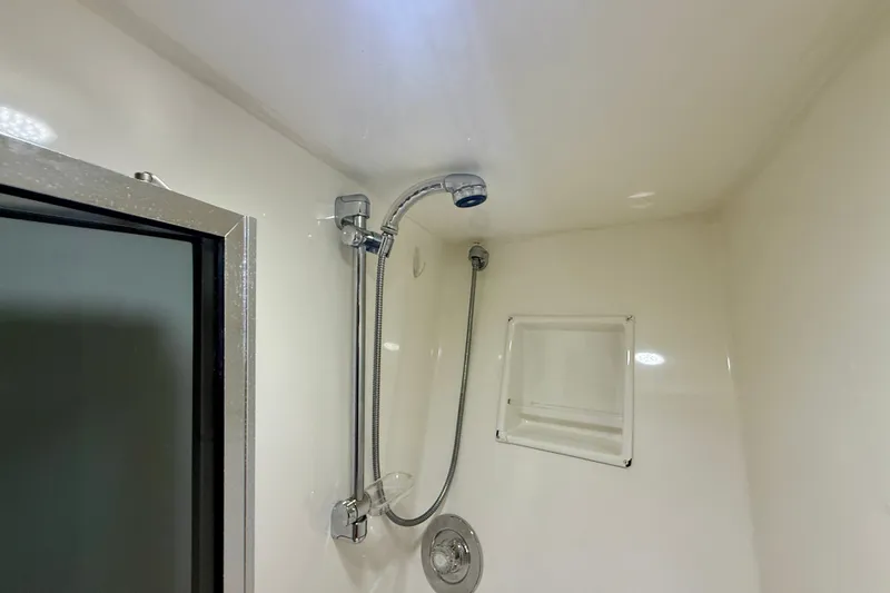 Slide: The Image of Shower area in 1994 Viking 47 Convertible yacht, featuring modern fixtures and sleek design. - 29