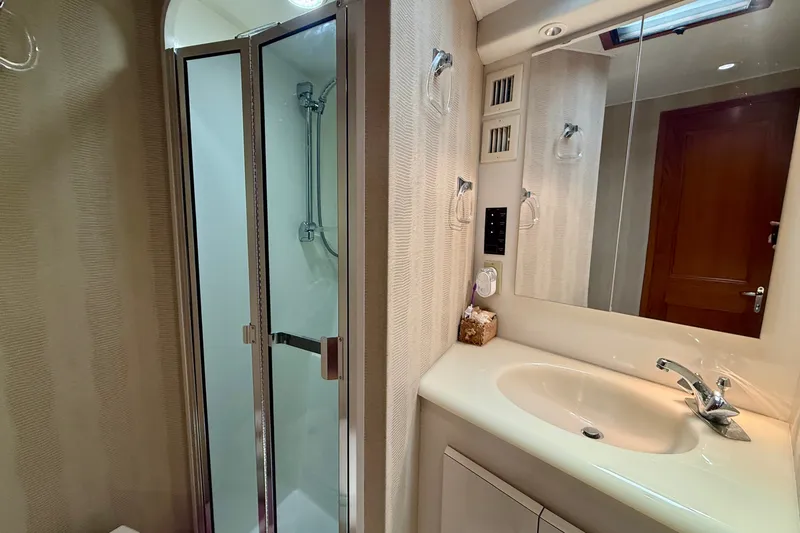 Slide: The Image of Bathroom interior of a 1994 Viking 47 Convertible yacht with shower and sink. - 32