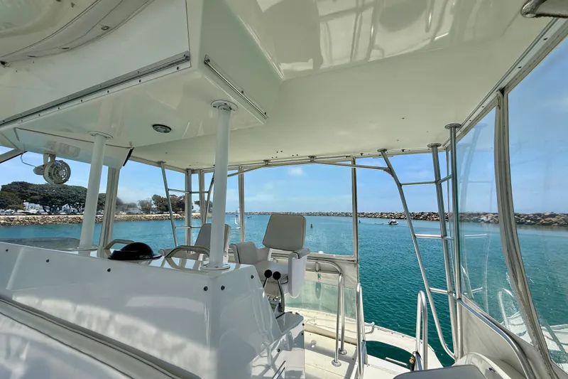 Slide: The Image of 1994 Viking 47 Convertible yacht interior with ocean view and clear skies. - 56