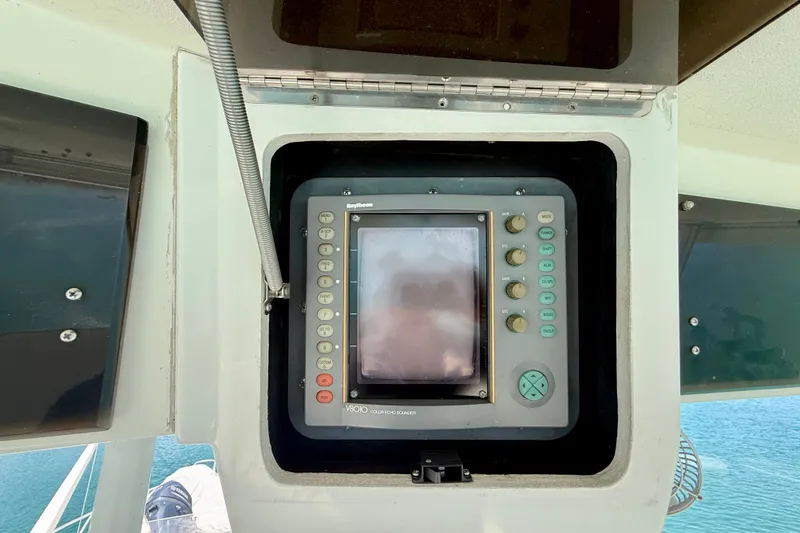 Slide: The Image of Navigation system on a 1994 Viking 47 Convertible yacht, featuring a Raytheon radar display. - 66