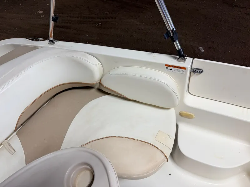 Slide: The Image of Close-up of a white boat seat with beige padding and a grab handle. - 41