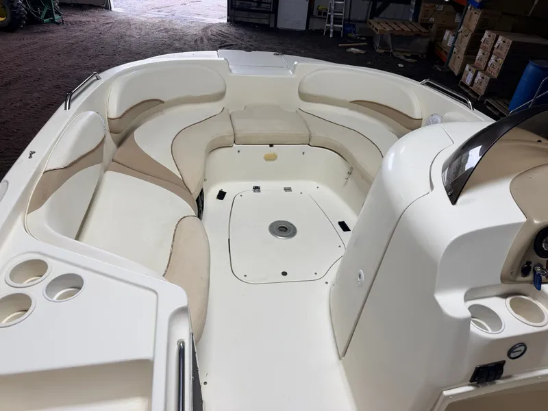 Slide: The Image of Interior view of a Glastron DX215 deck boat with beige and white seating. - 32