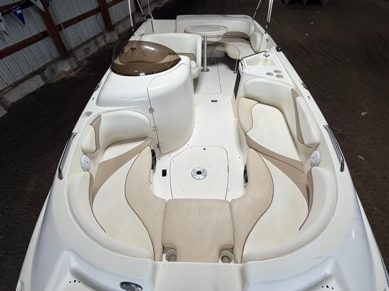 Slide: The Image of Interior view of a Glastron DX215 deck boat with beige and white seating. - 2
