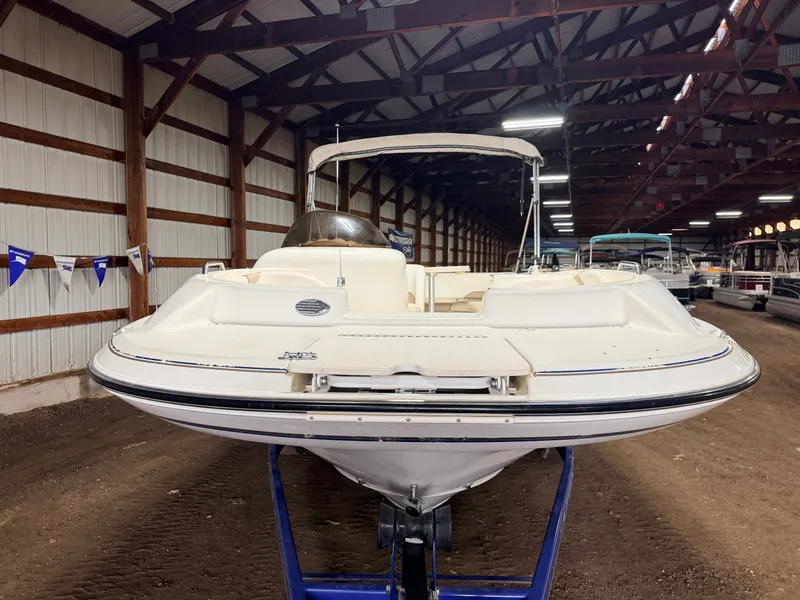 Slide: The Image of 2003 Glastron DX215 deck boat with 220HP Volvo/Penta engine and tandem axle trailer. - 50