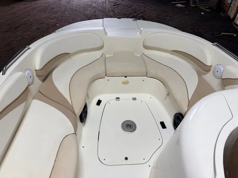 Slide: The Image of Interior view of a Glastron DX215 deck boat with beige and white seating. - 3