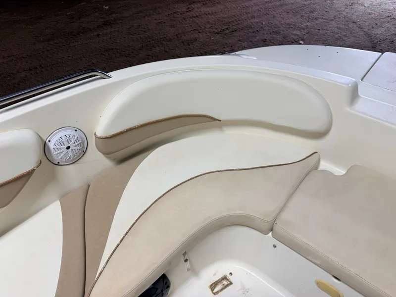 Slide: The Image of Interior view of a boat with beige cushions and a speaker. - 18