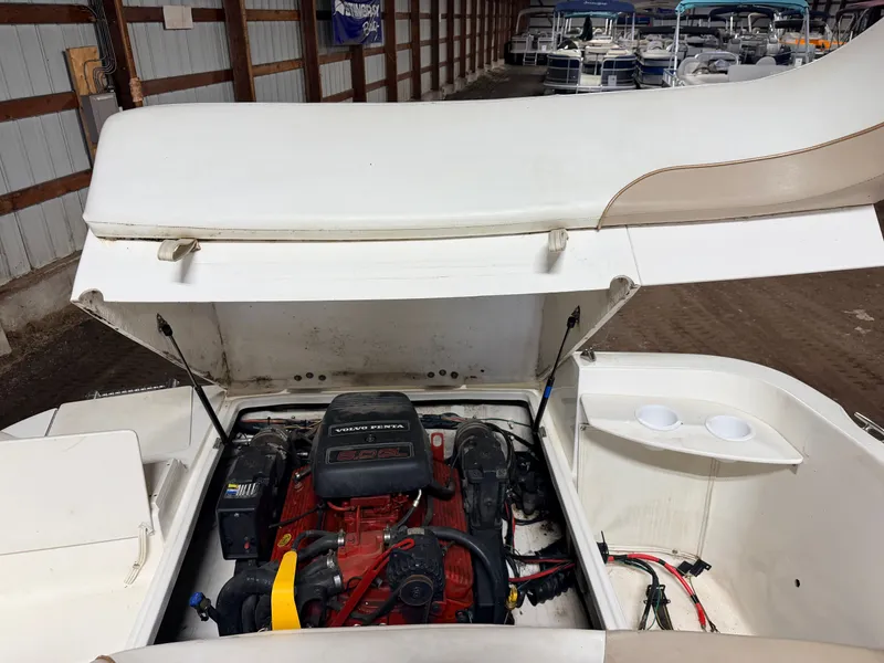 Slide: The Image of Engine compartment of a Glastron DX215 deck boat with Volvo/Penta engine, inside a storage facility. - 43