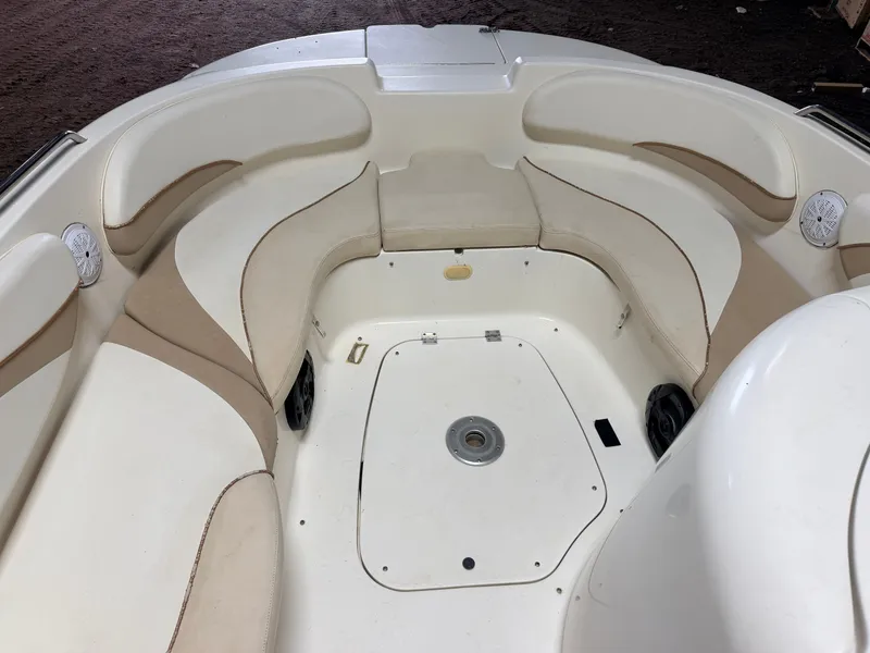 Slide: The Image of Interior view of a Glastron DX215 deck boat with beige and white seating. - 15
